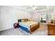 Inviting main bedroom with tray ceilings leading into ensuite bathroom at 138 Huntly Ln, Mooresville, NC 28115