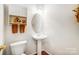 Charming powder room with pedestal sink and decorative mirror at 138 Huntly Ln, Mooresville, NC 28115