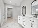 Elegant bathroom with double vanity, marble tile, and modern fixtures at 2109 Goose Creek Farm Ln, Indian Trail, NC 28079