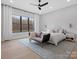 Main bedroom with a ceiling fan, sitting area and en-suite bathroom at 2109 Goose Creek Farm Ln, Indian Trail, NC 28079