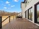 Large deck with seating area overlooking backyard at 2109 Goose Creek Farm Ln, Indian Trail, NC 28079