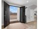 Stunning entryway with double doors opening to a view of the backyard at 2109 Goose Creek Farm Ln, Indian Trail, NC 28079