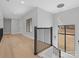 Bright foyer with hardwood floors, black railings, and a modern chandelier at 2109 Goose Creek Farm Ln, Indian Trail, NC 28079