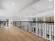 Open concept hallway with hardwood floors and a chandelier at 2109 Goose Creek Farm Ln, Indian Trail, NC 28079