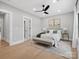 Inviting main bedroom with large window, ceiling fan, and bench at 2109 Goose Creek Farm Ln, Indian Trail, NC 28079