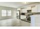 Modern kitchen with white cabinets and stainless steel appliances at 3308 Lemongrass Ln, Charlotte, NC 28214