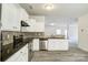 Modern kitchen with white cabinets and stainless steel appliances at 3308 Lemongrass Ln, Charlotte, NC 28214