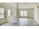 Bright living room with hardwood floors, and staircase at 3308 Lemongrass Ln, Charlotte, NC 28214