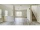 Bright living room with hardwood floors, and staircase at 3308 Lemongrass Ln, Charlotte, NC 28214