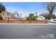 Brick home with a large backyard and brick wall at 515 S Academy St, Lincolnton, NC 28092
