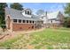 Brick home with a large backyard, patio, and fire pit at 515 S Academy St, Lincolnton, NC 28092