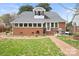 Brick home with a large backyard, patio, and fire pit at 515 S Academy St, Lincolnton, NC 28092