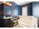 Bathroom with soaking tub and shower at 515 S Academy St, Lincolnton, NC 28092