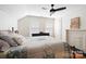 Cozy bedroom with hardwood floors and ceiling fan at 515 S Academy St, Lincolnton, NC 28092