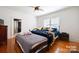 Spacious bedroom with hardwood floors and a ceiling fan at 515 S Academy St, Lincolnton, NC 28092