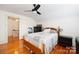 Spacious bedroom with hardwood floors and ceiling fan at 515 S Academy St, Lincolnton, NC 28092