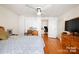 Bright bedroom with hardwood floors and ceiling fan at 515 S Academy St, Lincolnton, NC 28092