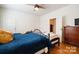 Spacious bedroom with hardwood floors and ceiling fan at 515 S Academy St, Lincolnton, NC 28092