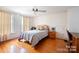 Bedroom with hardwood floors and large windows at 515 S Academy St, Lincolnton, NC 28092