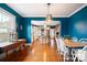 Bright dining room features hardwood floors and an open view to the kitchen at 515 S Academy St, Lincolnton, NC 28092