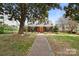 Brick home with a large front yard and walkway at 515 S Academy St, Lincolnton, NC 28092
