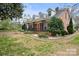 Brick home with a large front porch and side yard at 515 S Academy St, Lincolnton, NC 28092