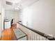 Upstairs hallway with hardwood floors and built-in storage at 515 S Academy St, Lincolnton, NC 28092