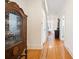 Long hallway with hardwood floors and antique furniture at 515 S Academy St, Lincolnton, NC 28092