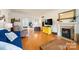 Living room with hardwood floors, fireplace, and yellow cabinet at 515 S Academy St, Lincolnton, NC 28092
