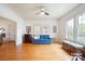 Bright living room featuring hardwood floors and a comfy blue couch at 515 S Academy St, Lincolnton, NC 28092