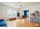 Hardwood floor living room, with a blue couch and built-in window seat at 515 S Academy St, Lincolnton, NC 28092