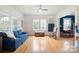 Living room with hardwood floors, blue couch, and open concept design at 515 S Academy St, Lincolnton, NC 28092