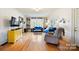 Living room with hardwood floors, fireplace, and built-in bookshelves at 515 S Academy St, Lincolnton, NC 28092