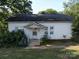 Front view of a white single story home with small front porch and yard at 1116 Medlin Rd, Monroe, NC 28112