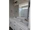 Bathroom featuring double sinks with white cabinets, granite countertops, and a glass shower at 2054 Cane Mill Rd, Lancaster, SC 29720