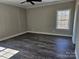 Spacious bedroom featuring hardwood floors, a ceiling fan, and a bright window at 2054 Cane Mill Rd, Lancaster, SC 29720