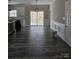 Open-concept dining area features dark floors, modern wainscoting, and sliding glass doors to the outdoors at 2054 Cane Mill Rd, Lancaster, SC 29720