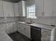 Bright kitchen featuring white cabinetry, stainless steel appliances, granite countertops, and subway tile backsplash at 2054 Cane Mill Rd, Lancaster, SC 29720