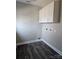 The laundry room has white cabinets above the washer and dryer hookups at 2054 Cane Mill Rd, Lancaster, SC 29720