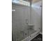 Glass-enclosed shower with gray tile and a built-in seat at 2054 Cane Mill Rd, Lancaster, SC 29720