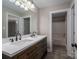 Bathroom featuring double vanity with stone countertop and wood cabinets and a water closet at 2840 Wheat Field Ct, Lincolnton, NC 28092