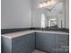 Bathroom vanity with quartz countertops, blue tile backsplash, and ample storage space at 2840 Wheat Field Ct, Lincolnton, NC 28092