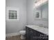 Elegant bathroom boasts marble countertop vanity and window with natural light at 2840 Wheat Field Ct, Lincolnton, NC 28092