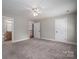 Neutral bedroom featuring connecting ensuite bath and large door for closet at 2840 Wheat Field Ct, Lincolnton, NC 28092