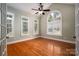 Light-filled bonus room with hardwood floors and an arch window at 2840 Wheat Field Ct, Lincolnton, NC 28092