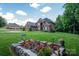 Charming two-story brick home with an arched entryway, situated on a well-manicured lawn at 2840 Wheat Field Ct, Lincolnton, NC 28092