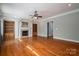 Bright and open living room with a fireplace, custom built-ins, hardwood floors, and neutral paint, ready for personalization at 2840 Wheat Field Ct, Lincolnton, NC 28092