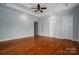 Spacious main bedroom features a tray ceiling, ceiling fan, and gleaming hardwood floors at 2840 Wheat Field Ct, Lincolnton, NC 28092