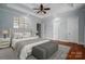 Spacious main bedroom features a tray ceiling, ceiling fan, and a neutral color palette at 2840 Wheat Field Ct, Lincolnton, NC 28092