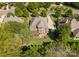 Aerial view of a luxurious home with a large backyard and surrounding landscape at 308 Montrose Dr, Waxhaw, NC 28173